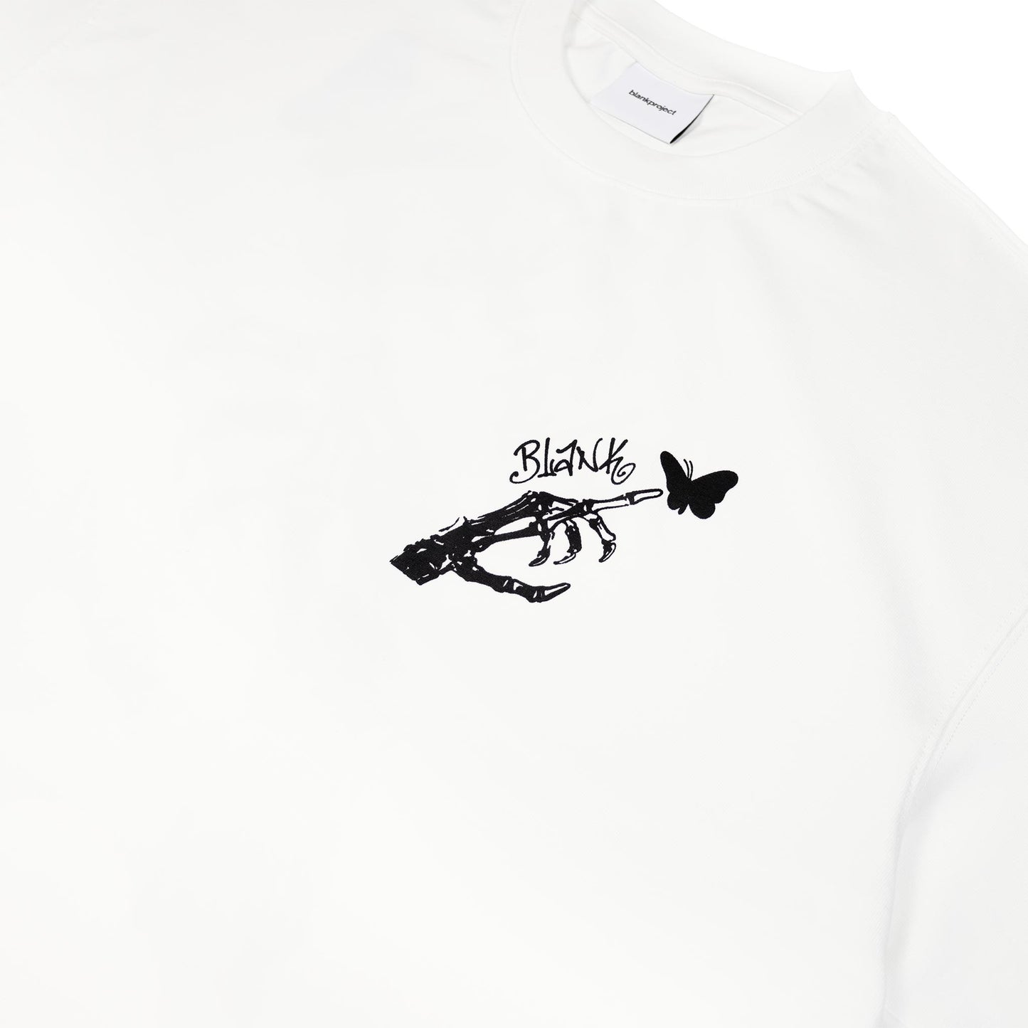Skeleton Hand with butterfly graphic on white t shirt