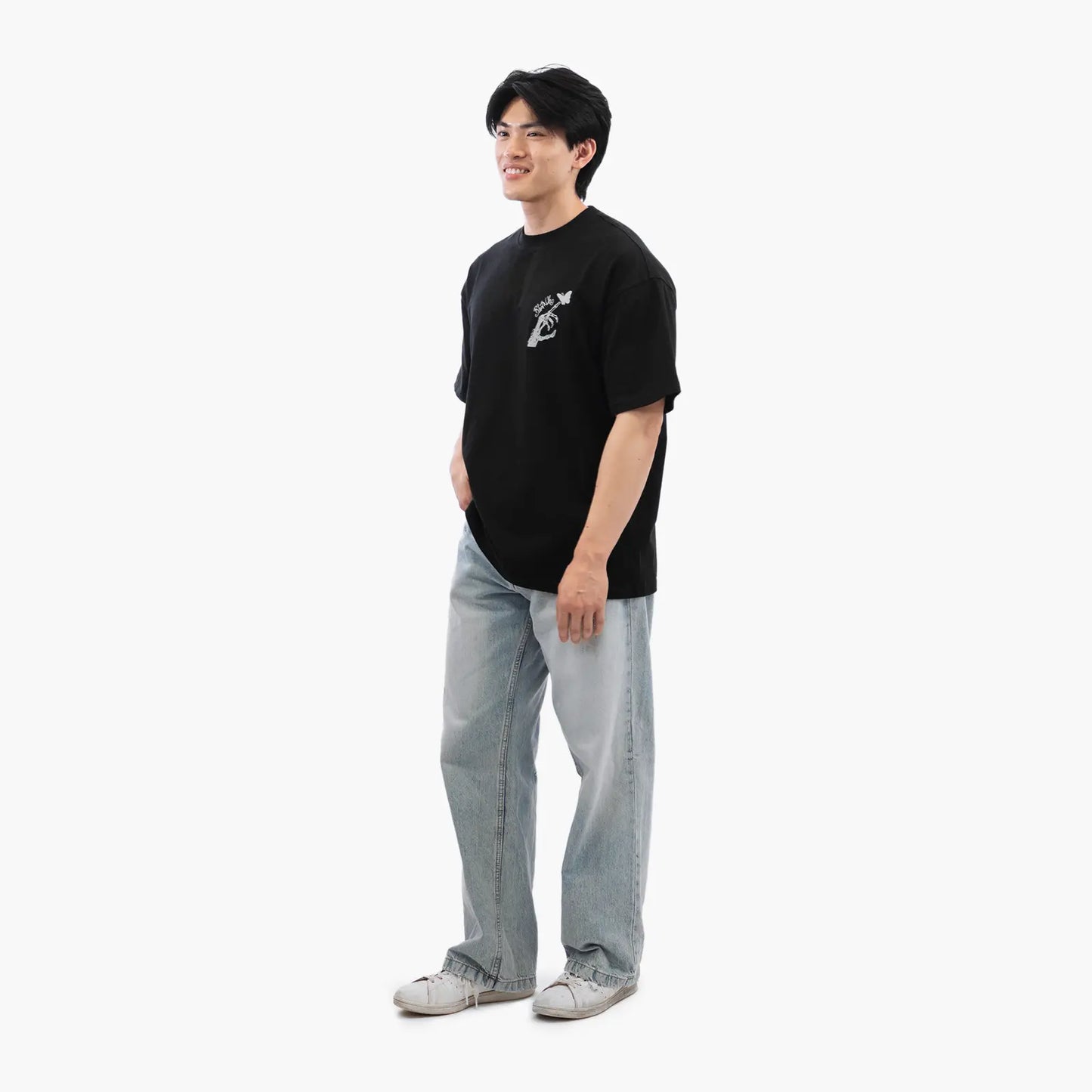 Model wears Blank Project Skeleton Hand Graphic Short Sleeve T-Shirt in black color