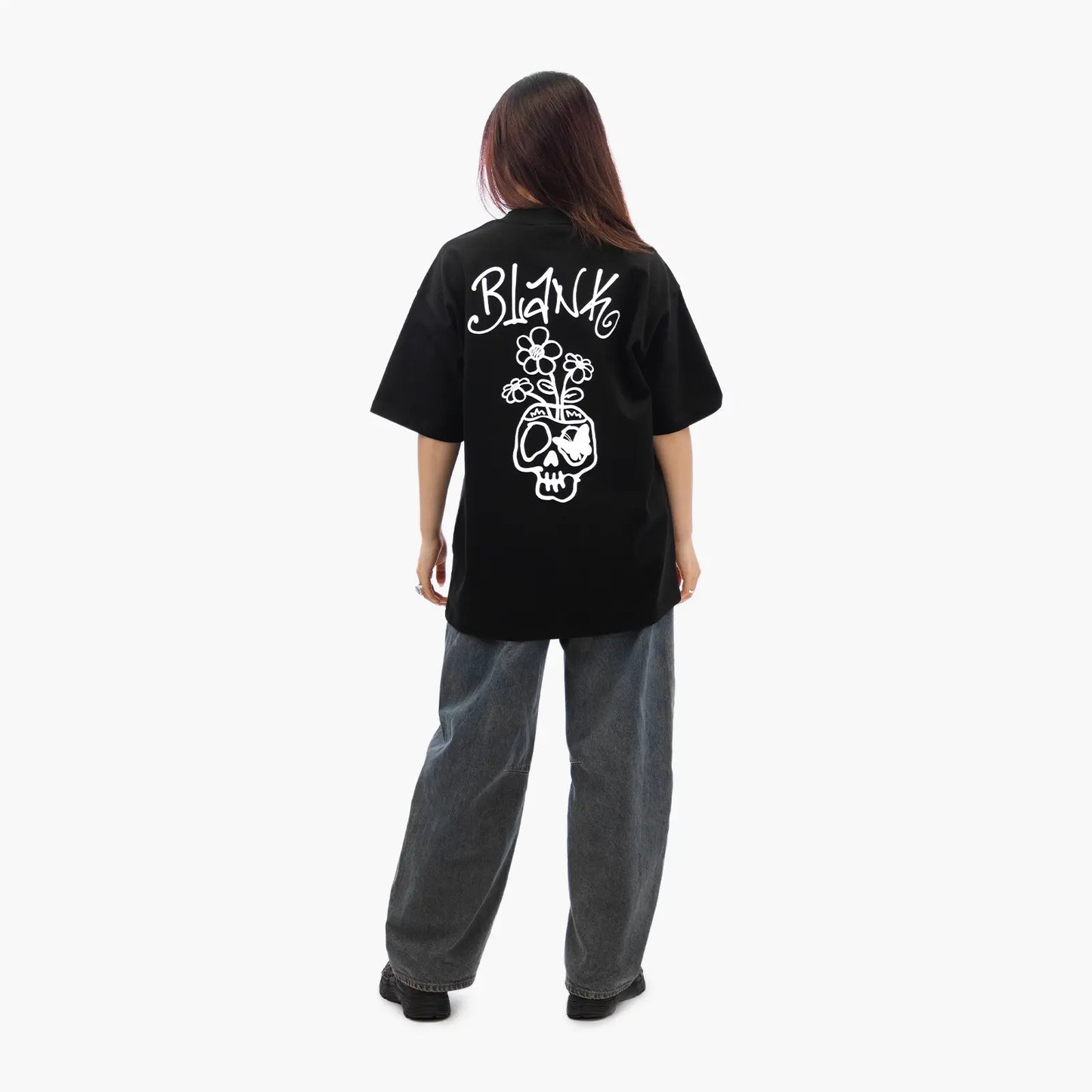 Model wears Blank Project Flower Skull Graphic Short Sleeve T-Shirt in Black Color