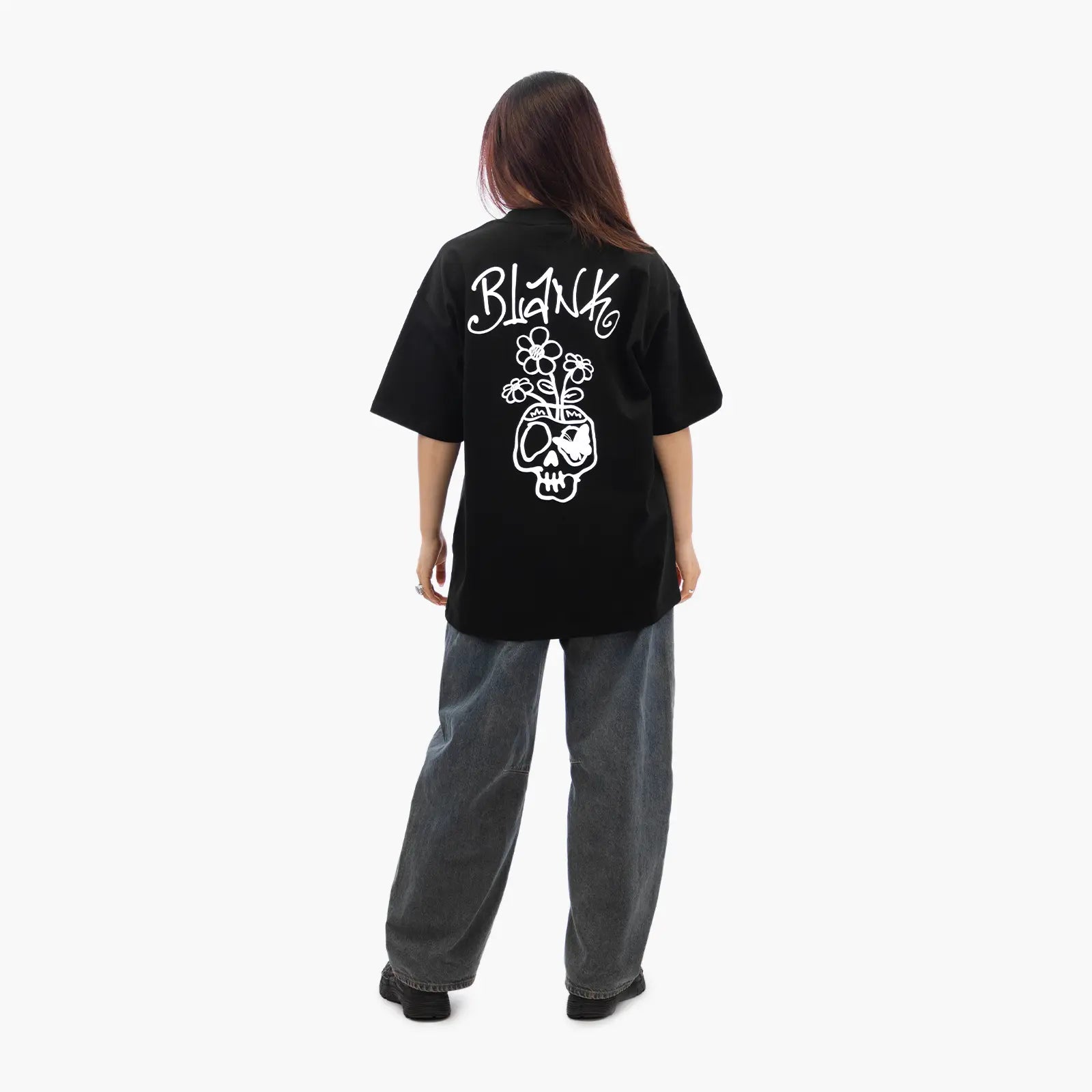 Model wears Blank Project Flower Skull Graphic Short Sleeve T-Shirt in Black Color