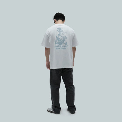 Model wearing Blank Project alien with flower and butterfly graphic short sleeve t-shirt in white color