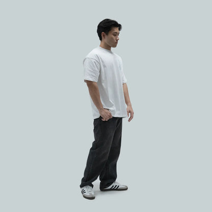 Model wearing Blank Project alien with flower and butterfly graphic short sleeve t-shirt in white color