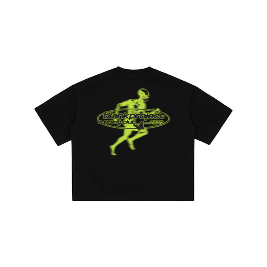 Black t-shirt with yellow alien graphic design on a white background